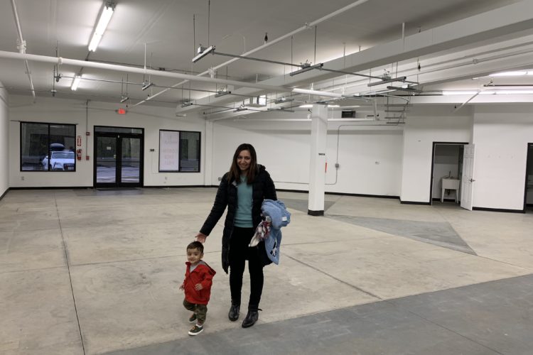 Woman and child in empty commercial space